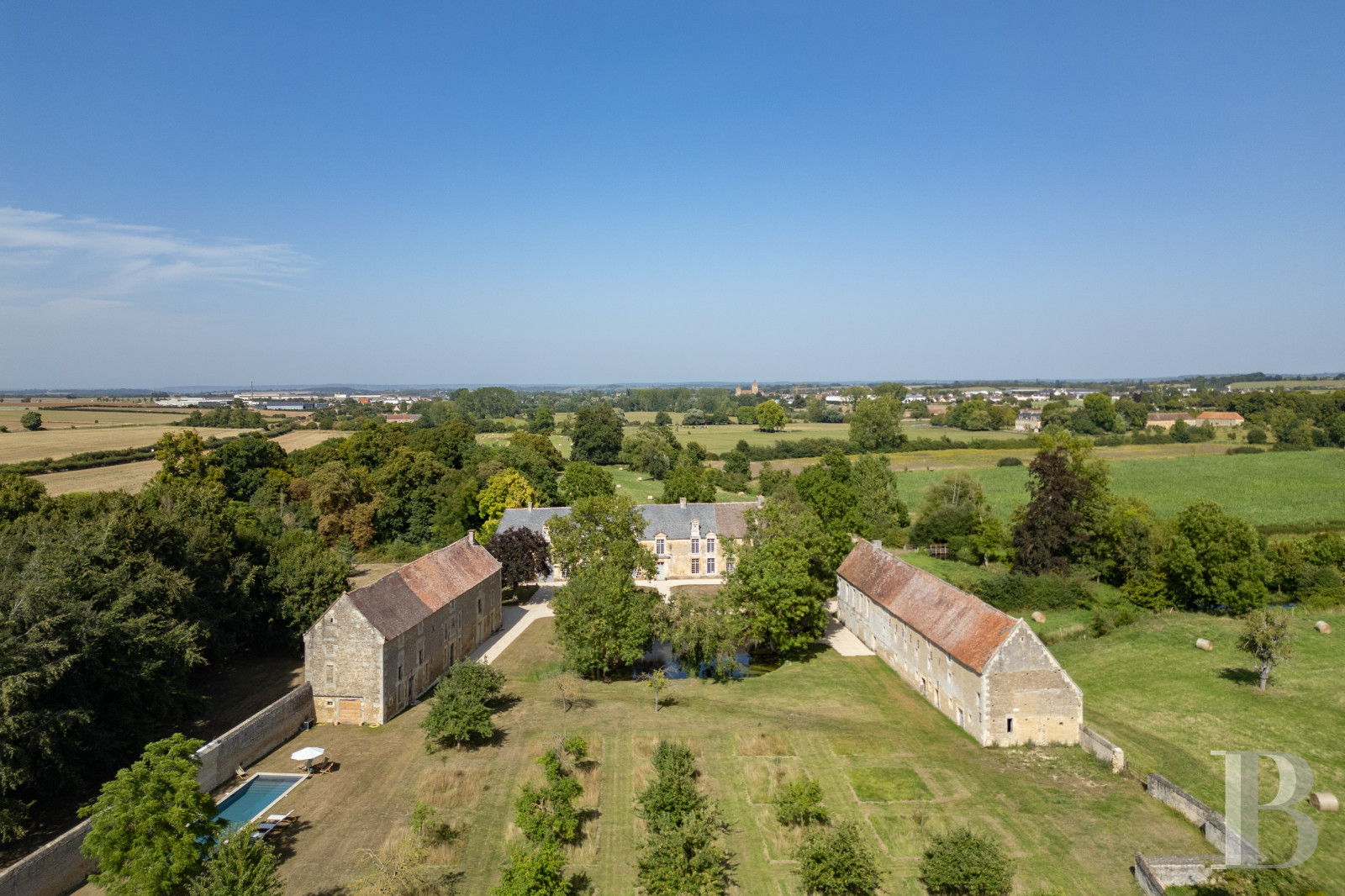 A château and its outbuildings in walled grounds to the north-east of Falaise, in Calvados - photo  n°1